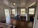 Living room with wood floors and wood stove at 13369 Cr 719, Webster, FL 33597