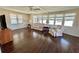 Cozy living room featuring hardwood floors and natural light at 136 Dogwood Trl, Leesburg, FL 34748