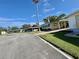 View of the neighborhood and home featuring a well-maintained lawn at 136 Dogwood Trl, Leesburg, FL 34748