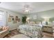 Main bedroom with ceiling fan and en-suite bathroom at 1504 Aalto Pl, The Villages, FL 32159