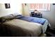 Comfortable bedroom with a double bed and nightstand at 15906 Douglas Rd, Mascotte, FL 34753