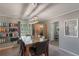 Bright dining area with a granite-top table and built-in shelving for storage at 1625 Virginia Dr, Clermont, FL 34711