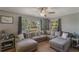 Relaxing living room featuring a large sectional sofa and ample natural light from a large window at 1625 Virginia Dr, Clermont, FL 34711