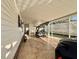 Extended carport featuring a golf cart and stamped concrete floor at 169 Bougainvillea Dr, Leesburg, FL 34748