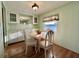 Dining area with wood floors, built-in storage, and a view outside at 169 Bougainvillea Dr, Leesburg, FL 34748