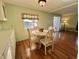 Cozy dining area with natural light, seating four, adjacent to the kitchen at 169 Bougainvillea Dr, Leesburg, FL 34748