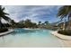 Resort-style pool with shaded seating and lounge chairs at 17442 Blazing Star Cir, Clermont, FL 34714