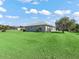 Large backyard with lush grass surrounds this home at 17525 Se 121St Cir, Summerfield, FL 34491