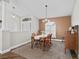 Formal dining room with large window, decorative pillar, and classic furniture at 17525 Se 121St Cir, Summerfield, FL 34491