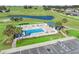 Aerial shot of a beautiful pool with a sun deck and white fence surround at 17525 Se 121St Cir, Summerfield, FL 34491