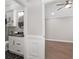 Bathroom with marble countertops, black and white backsplash and stylish lighting at 17760 Se 91St Gaylark Ave, The Villages, FL 32162