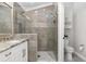 Beautiful bathroom showcasing a walk-in shower, modern fixtures, and stylish design at 17760 Se 91St Gaylark Ave, The Villages, FL 32162