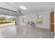 Spacious garage with epoxy flooring and ample natural light at 17760 Se 91St Gaylark Ave, The Villages, FL 32162