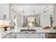 Open kitchen view into the living room and vaulted ceiling, showcasing the home's layout at 17760 Se 91St Gaylark Ave, The Villages, FL 32162