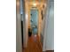 Hallway with wood-look flooring and access to other rooms at 185 Jacaranda Dr, Leesburg, FL 34748