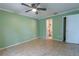 Bedroom with tile floors, ceiling fan, and bathroom access at 1906 Nancy Ann Ter, Ocoee, FL 34761