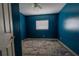 Blue bedroom with patterned rug and window at 1906 Nancy Ann Ter, Ocoee, FL 34761