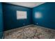 Blue bedroom with patterned rug and window at 1906 Nancy Ann Ter, Ocoee, FL 34761