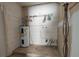 Laundry room with water heater and shelving at 1906 Nancy Ann Ter, Ocoee, FL 34761