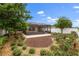 Enjoy the backyard with landscaping and a screened lanai that is perfect for outdoor living at 1941 Loadstar Ave, The Villages, FL 32162