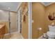 Bright bathroom featuring a glass enclosed shower, tile flooring, and vanity with marble countertops at 1941 Loadstar Ave, The Villages, FL 32162