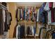 Spacious walk-in closet with built-in shelving and clothing racks, providing ample storage space at 1941 Loadstar Ave, The Villages, FL 32162