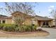 Charming single-story home featuring a well-manicured lawn and landscaped front yard with decorative rocks and plants at 1941 Loadstar Ave, The Villages, FL 32162