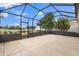 The spacious lanai provides outdoor living with a screened enclosure and views of the golf course at 1941 Loadstar Ave, The Villages, FL 32162