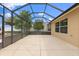 A view of the lanai with a concrete floor and screen enclosure that allows natural light at 1941 Loadstar Ave, The Villages, FL 32162