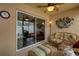 Comfortable lanai perfect for entertaining, featuring wicker furniture and views of the outdoors at 1941 Loadstar Ave, The Villages, FL 32162