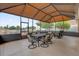 Large screened patio with a dining table set, offering an ideal space for outdoor meals and gatherings at 1941 Loadstar Ave, The Villages, FL 32162