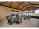 Inviting screened patio with comfortable seating, creating a perfect spot for relaxation and outdoor enjoyment at 1941 Loadstar Ave, The Villages, FL 32162