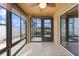 The sunroom offers great views, tile floors, a ceiling fan, and access to the screened lanai at 1941 Loadstar Ave, The Villages, FL 32162