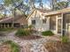 Landscaped backyard with stone pathway and lush greenery at 2042 Eagles Rest Dr, Apopka, FL 32712