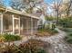 Stone pathway meanders through a tranquil backyard landscape at 2042 Eagles Rest Dr, Apopka, FL 32712