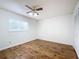 Spacious bedroom featuring wood-look floors and a ceiling fan at 2042 Eagles Rest Dr, Apopka, FL 32712