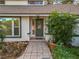 Front entry with a green door and stone pathway at 2042 Eagles Rest Dr, Apopka, FL 32712