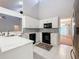 Modern kitchen featuring white cabinets, black appliances, and tile backsplash at 2042 Eagles Rest Dr, Apopka, FL 32712