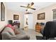 Bright home office with a desk, comfortable sofa and ceiling fan at 2043 Sawgrass Dr, Apopka, FL 32712