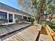 Spacious wooden deck with benches, perfect for relaxing at 208 First St, Tavares, FL 32778