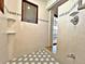 Bathroom with shower and hexagonal tile floor at 208 First St, Tavares, FL 32778