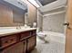 Bathroom with shower/tub combo and patterned tile floors at 208 First St, Tavares, FL 32778