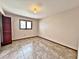 Simple bedroom with tile floors and a closet at 208 First St, Tavares, FL 32778