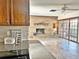 Brick fireplace and sliding glass doors are featured in this dining area at 208 First St, Tavares, FL 32778