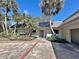 House exterior with palm trees and brick walkway at 208 First St, Tavares, FL 32778