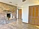 Brick fireplace and built-in shelving in this living room at 208 First St, Tavares, FL 32778