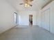 Main bedroom with carpet flooring and walk-in closet at 2289 Twickingham Ct, Clermont, FL 34711