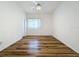 Bedroom with wood-look flooring and a ceiling fan at 2289 Twickingham Ct, Clermont, FL 34711