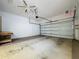 Garage with a workbench and ample space for storage at 2289 Twickingham Ct, Clermont, FL 34711