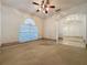 Living room with carpeted floor and ceiling fan at 2289 Twickingham Ct, Clermont, FL 34711